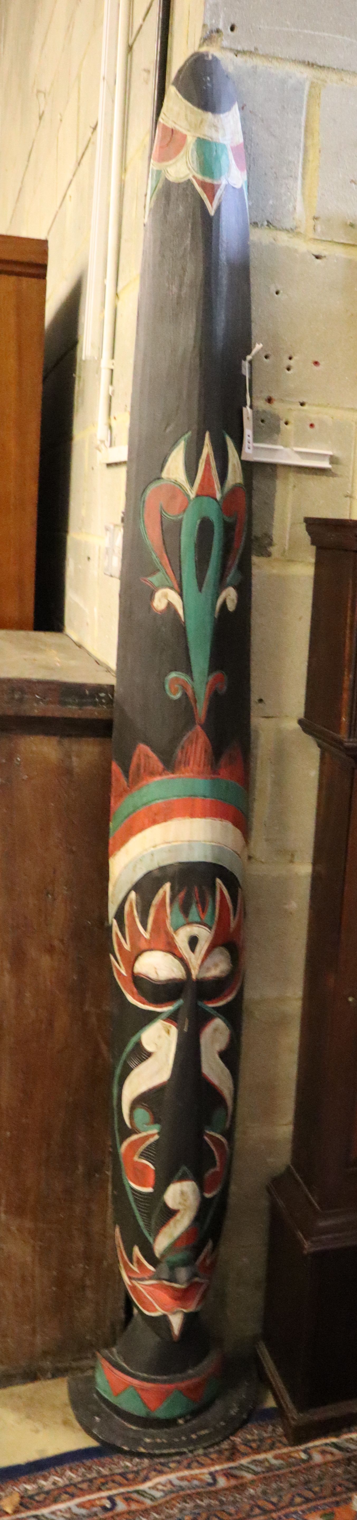 A Balinese carved and painted wood totem, height 203cm